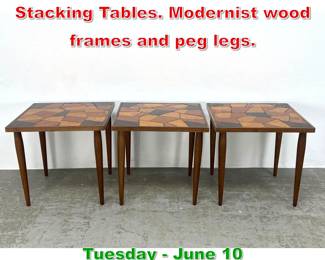 Lot 429 Set 3 Glass Glass Inlaid Stacking Tables. Modernist wood frames and peg legs.