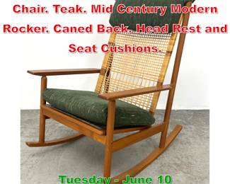 Lot 779 HANS OLSEN Rocking Chair. Teak. Mid Century Modern Rocker. Caned Back. Head Rest and Seat Cushions.