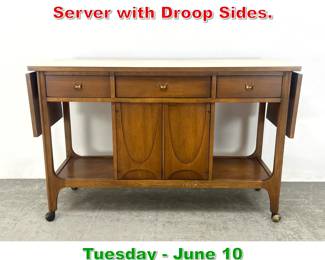 Lot 596 Broyhill Brasilia Bar Cart Server with Droop Sides.