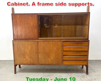 Lot 587 Danish Modern 2 Part Cabinet. A frame side supports.