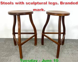 Lot 663 Pair Studiocrafted Walnut Stools with sculptural legs. Branded mark.