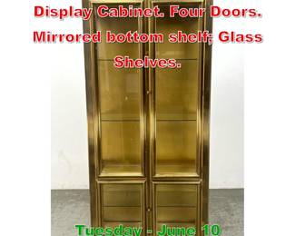 Lot 499 Mastercraft Antiqued Brass Display Cabinet. Four Doors. Mirrored bottom shelf Glass Shelves.