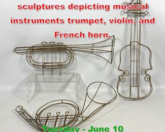 Lot 581 Set of three wire sculptures depicting musical instruments trumpet, violin, and French horn.