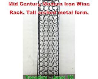 Lot 481 Tall Arthur Umanoff style Mid Century Modern Iron Wine Rack. Tall arched metal form.