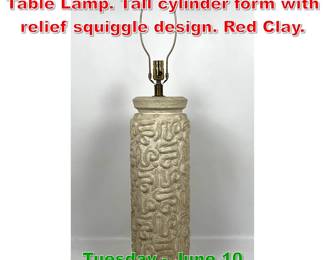 Lot 304 Modernist Glazed Pottery Table Lamp. Tall cylinder form with relief squiggle design. Red Clay.