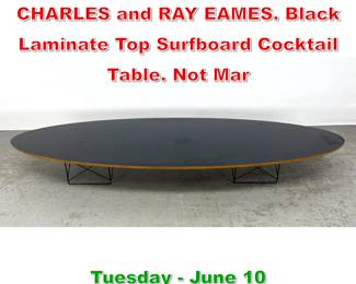 Lot 535 Elliptical Coffee Table. CHARLES and RAY EAMES. Black Laminate Top Surfboard Cocktail Table. Not Mar