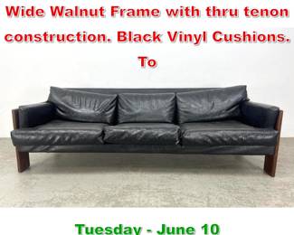 Lot 531 Adrian Pearsall Walnut Sofa Wide Walnut Frame with thru tenon construction. Black Vinyl Cushions. To