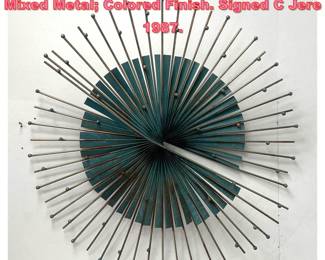 Lot 1002 C. Jere windmill wall sculpture. Mixed Metal Colored Finish. Signed C Jere 1987.