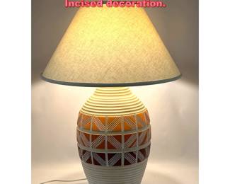 Lot 1347 Mid Century Modern Table Lamp. Incised decoration.