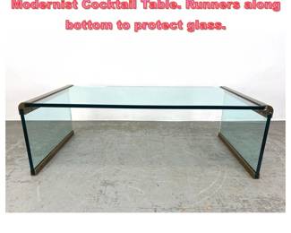 Lot 1356 After Pace Glass Brass Trim Modernist Cocktail Table. Runners along bottom to protect glass.