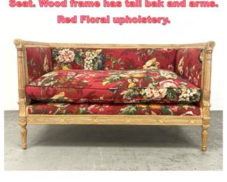 Lot 1392 French style Carved Settee Love Seat. Wood frame has tall bak and arms. Red Floral upholstery.