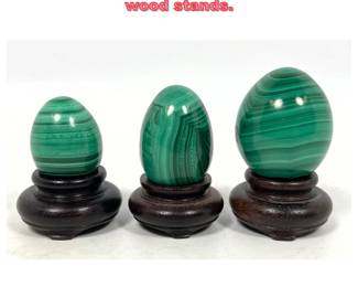 Lot 1100 set 3 Malachite Eggs on wood stands.