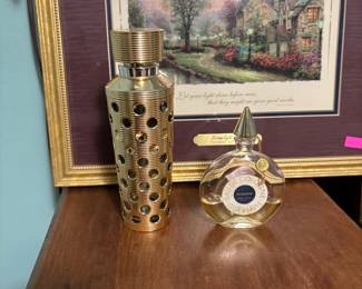A couple of Thomas Kincade art pieces