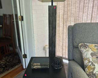 Side table with one of the two floor lamps