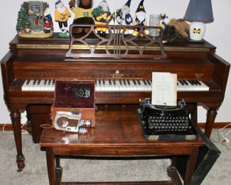 Lester Philadelphia piano,Remington Portable typewriter and Revere 16 camera and University of Michigan figures and lamp