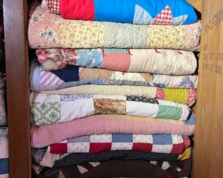 Assortment of hand made quilts