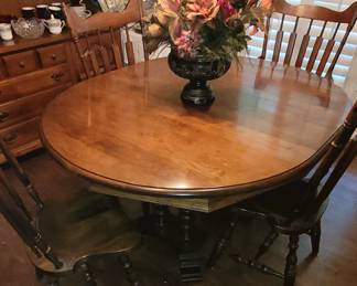 VERY NICE DINING TABLE WITH 6 CHAIRS, TABLE PADS AND AN EXTRA LEAF.