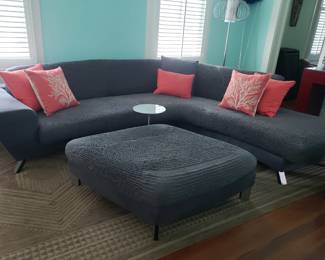 NATUZZI LEATHER SOFA AND OTTOMAN