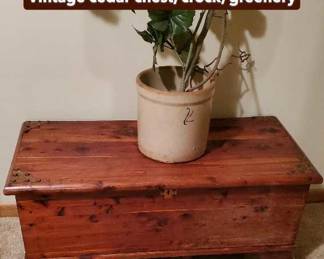 Vintage cedar chest, crock, greenery.