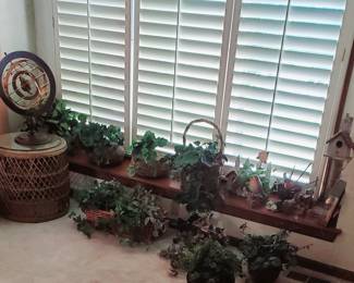 Decorative globe, rattan glass top accent table, baskets and greenery.