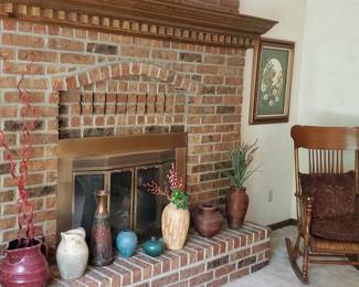 Decorative vases, roll front vintage wood rocker, framed artwork.