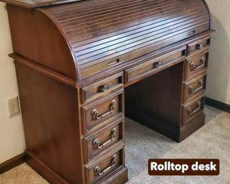 Roll top desk, vintage oil lamps.