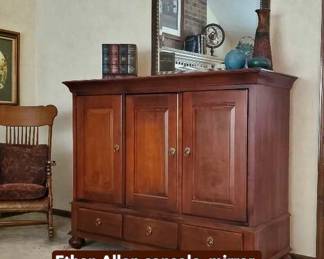 Ethan Allen entertainment console, vintage roll top wood rocker, mirror, decorative items.