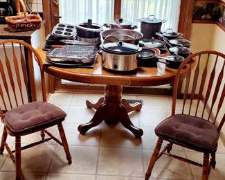 Table and 4 chairs, cookware, bakeware.