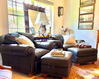 Pair of high end leather chairs and matching ottomans by Hancock & Moore