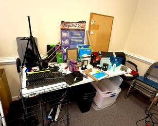 Hundreds of office supplies, computer, keyboards, cords, everything you need to set up shop! Multiple comfortable office chairs, tripod