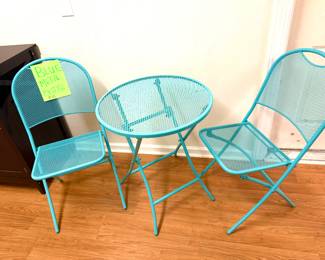 Beautiful blue metal bistro set folds up for easy storage