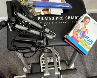 Pilates chair with books and accessories