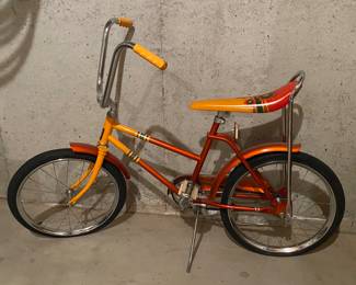 70s orange bicycle with banana seat.