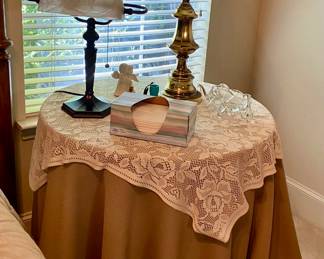 There are 2 of these side tables with matching table cloths.
