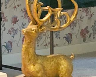 One of a pair of very large gold finish deer with candle cups on antlers