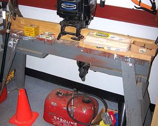 Mercury 9.8 outboard motor and stand, gas cans