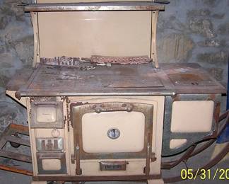 Old Majestic cook stove ( Will have to be disassembled to remove from basement.)