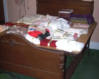 Victorian bed, linens, doilies, old children's clothes