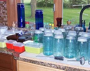 Pyrex dishes, dated blue canning jars w/ zinc tops, etc...