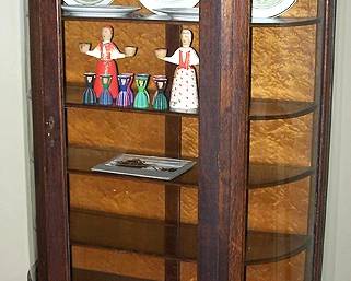 Curved glass china cabinet, Swedish folk are candle holders