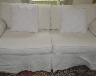 Comfy oversized seated couch with tailored slipcovers