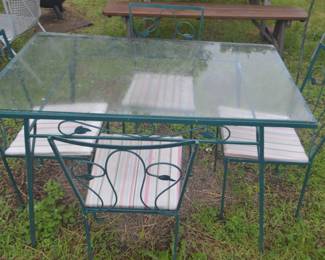 Vintage wrought iron patio set with glass top