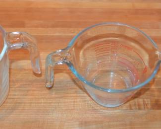 three glass Pyrex measuring cups