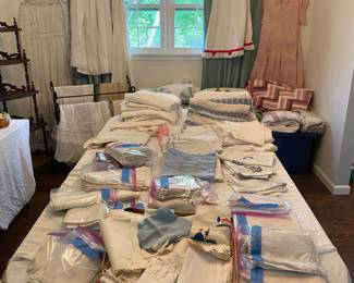 Linens including vintage napkins and tablecloths, quilts and clothing