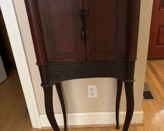 Leather Cabinet -Interesting legs and workmanship