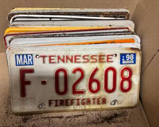 Dozens of vintage and antique license plates.