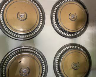4 Old Cadillac Hubcaps