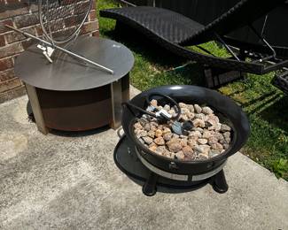 gas fire pit (right) , charcoal fire pit with grill attachment (left)