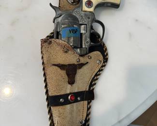 vintage toy gun and holster