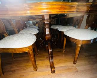 Beautiful ivory color upholstered seats and view of underside showing one of two pedestal legs